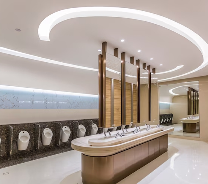 a bathroom with urinals and sinks