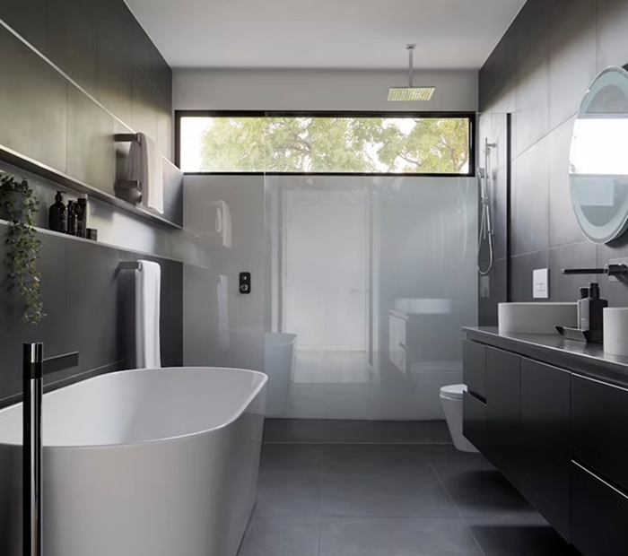a bathroom with a tub and sink